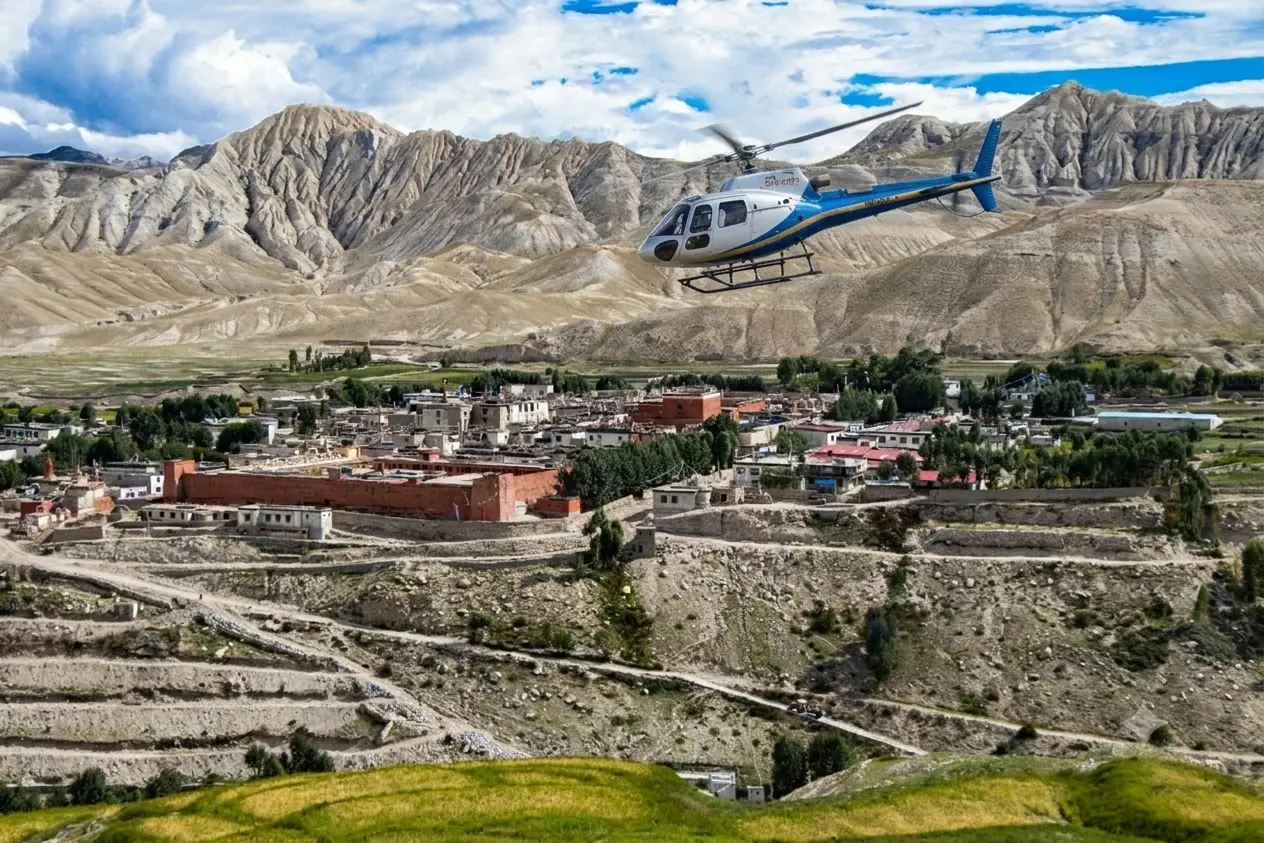 Aerial helicopter view over the arid cliffs and Tibetan-style villages of Upper Mustang, Nepal Himalayas