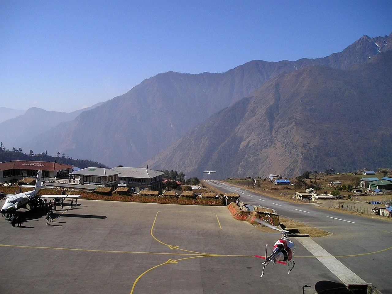 Helicopter in flight from Khare (Mardi Himal base camp) to Lukla airstrip, a short 15-18 minute high-altitude transfer in Nepal